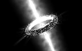 Black and white image of a ring that is lit on the inside by a beam of light going through the centre. Black background